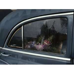  A Floral Arrangement Seen Through the Rain Spattered 