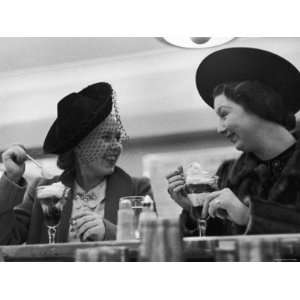  Pair of Women Chatting over Ice Cream at a Restaurant 