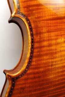   full sized violin. The back measures 13 7/8 inches or 354 mm