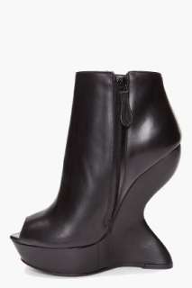 Alexander McQueen curved wedge boots for women  