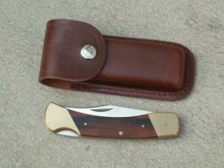 closed. Stainless clip blade. Wood handles with brass bolsters 