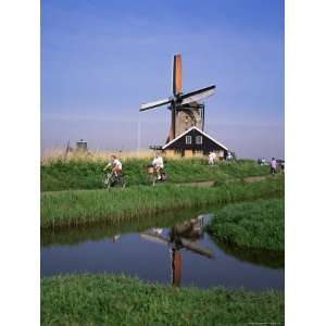 People Riding Bicycles, Zaanse Schans, Near Amsterdam, Holland Premium 